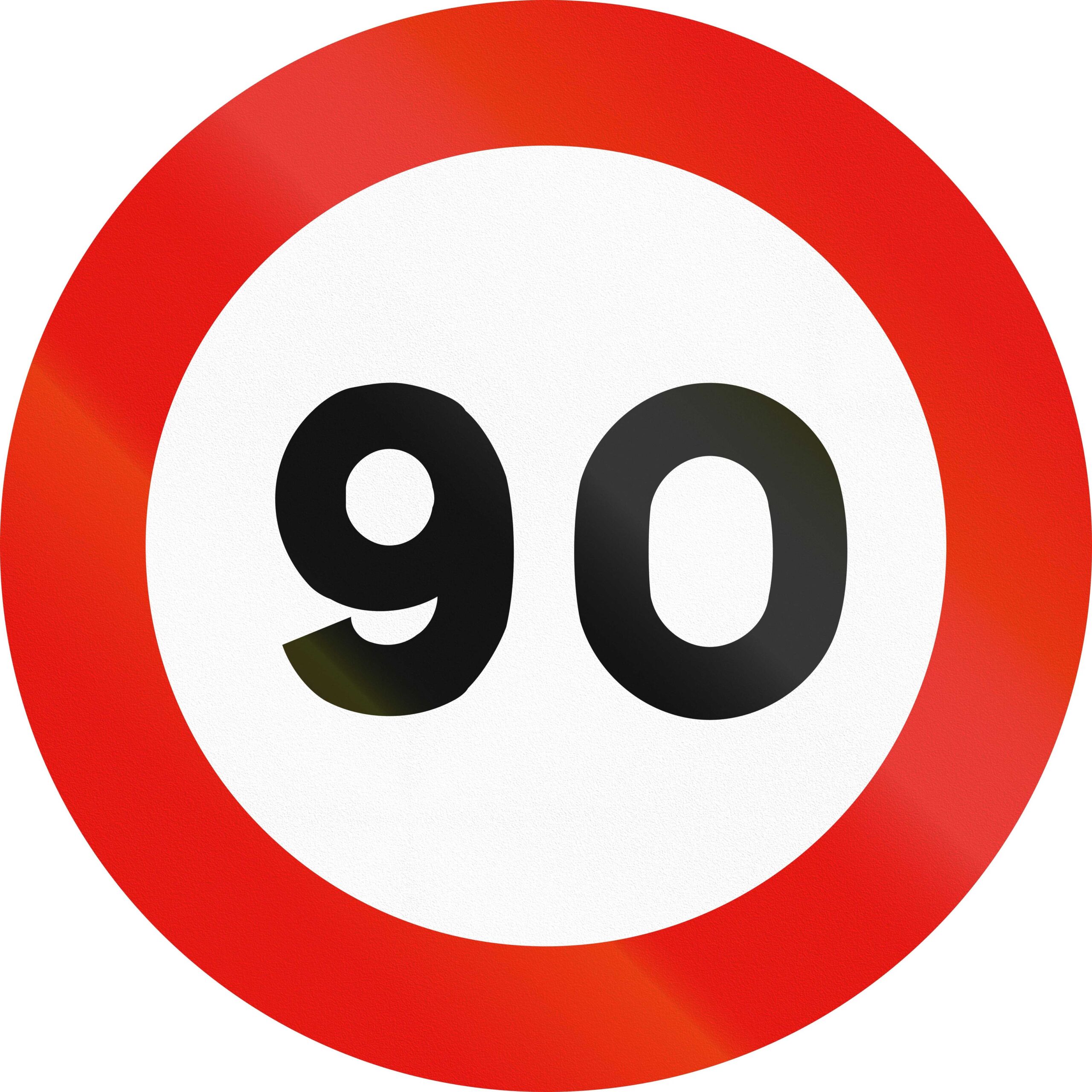 White circular road sign with red border and black number 90 in the middle showcasing speed limit.