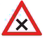 White triangle sign with red border and black cross in the middle.