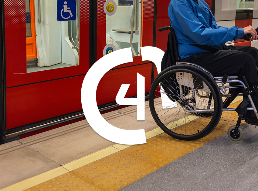 Wheelchair user waiting at metro station for assistance.